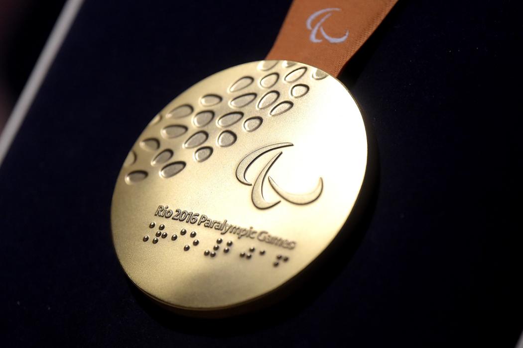 RIO DE JANEIRO, BRAZIL - JUNE 14: A close-up of the gold paralympic medal during the Launch of Medals and Victory Ceremonies for the Rio 2016 Olympic and Paralympic Games at the Future Arena in Olympic Park on June 14, 2016 in Rio de Janeiro, Brazil. (Photo by Alexandre Loureiro/Getty Images)